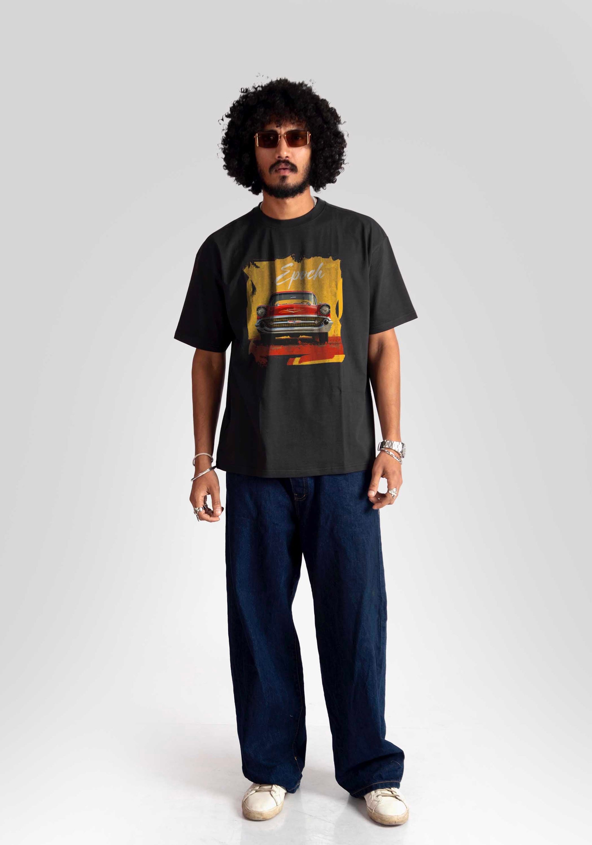 Man wearing Stylera regular fit vintage car t-shirt with graphic design and casual navy pants