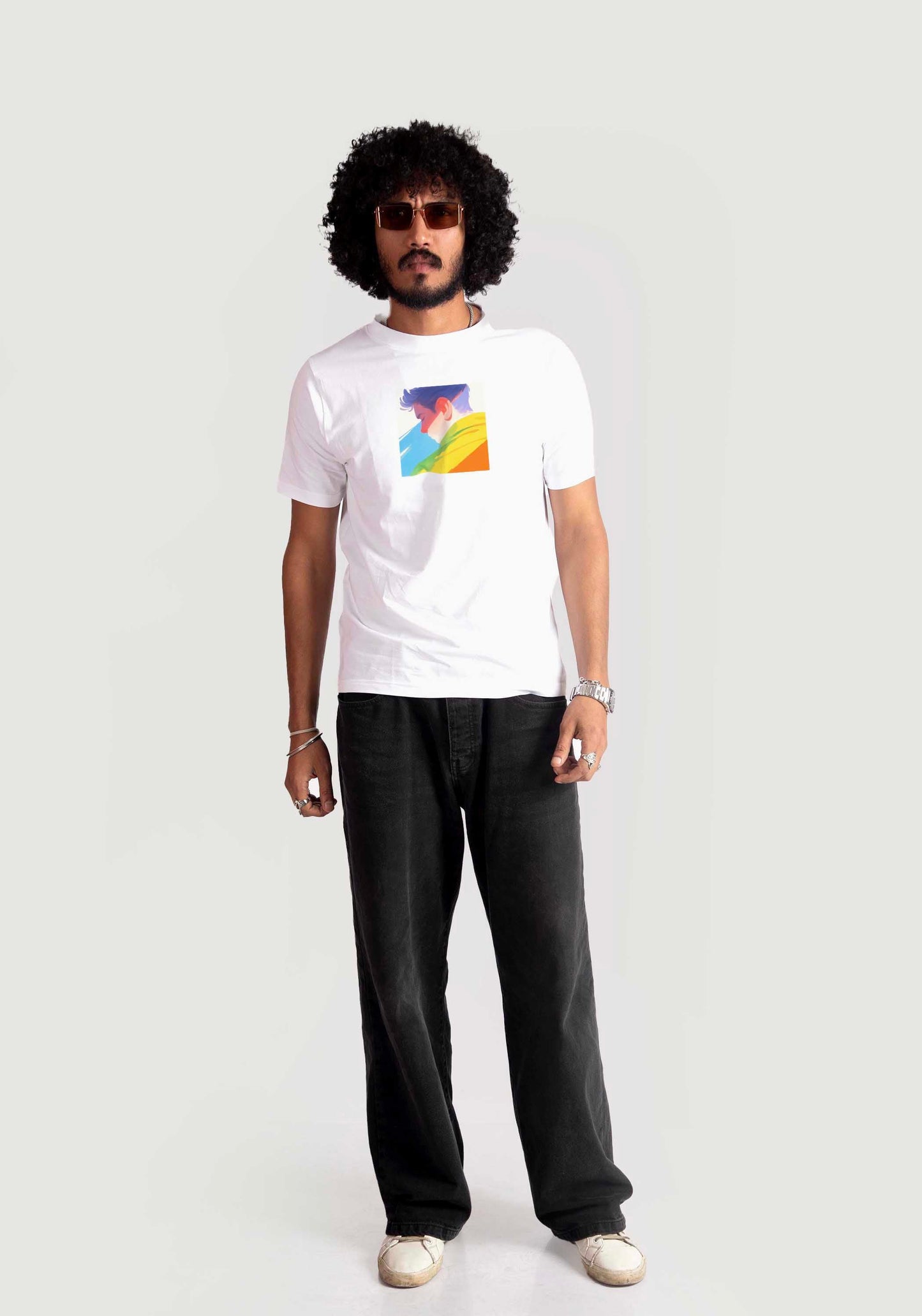 Man wearing Stylera regular fit white tee with colorful graphic and black pants