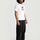 Man wearing regular fit Stylera  white tee with colorful graphic and black pants