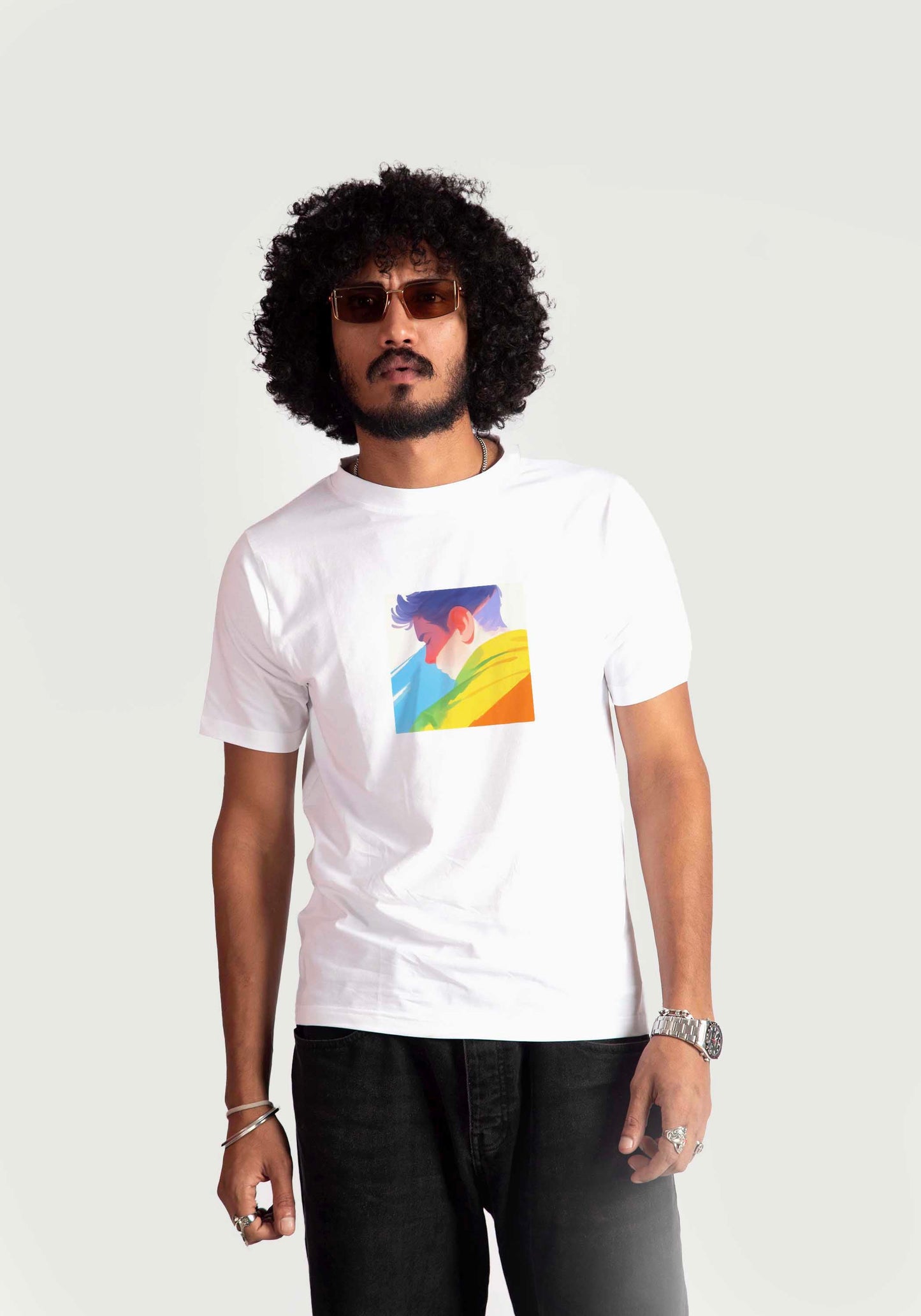 Stylera regular fit white tee with colorful graphic print worn by male model with curly hair and sunglasses