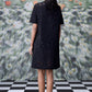 Back view of model wearing Stylera relaxed fit black dress for women in lace shift style