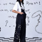 Stylera black wide leg dungaree with white print and pockets on model relaxed fit dungaree for women