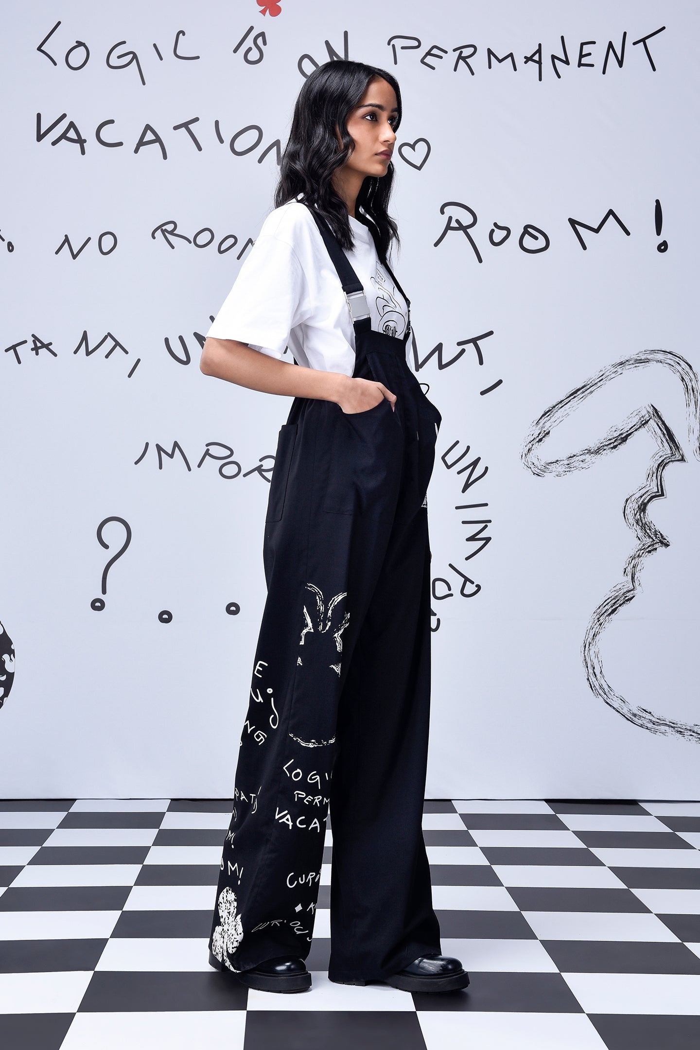 Stylera black wide leg dungaree with white print and pockets on model relaxed fit dungaree for women