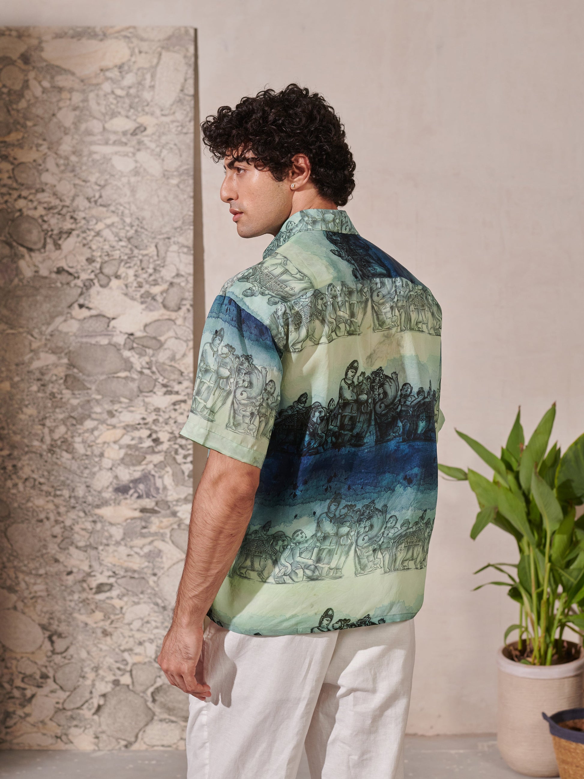 Back view of a Stylera's relaxed fit short sleeve shirt for men with artistic print and comfortable design