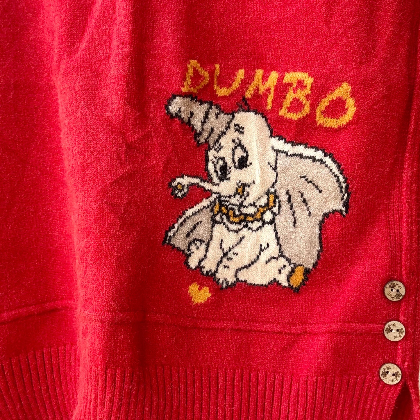 Red women's cartoon knit vest with vintage Dumbo elephant knit graphic and three side buttons