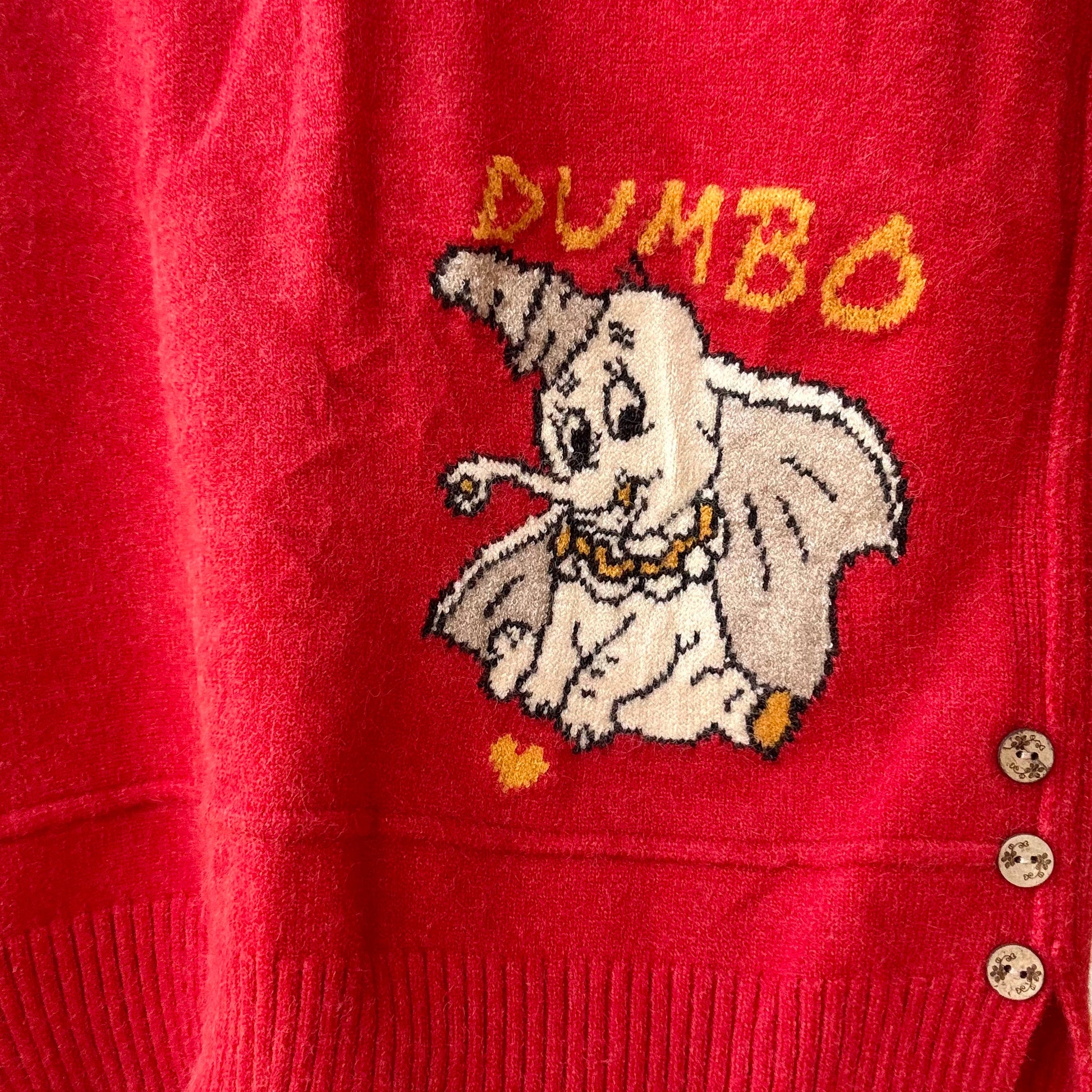 Red women's cartoon knit vest with vintage Dumbo elephant knit graphic and three side buttons