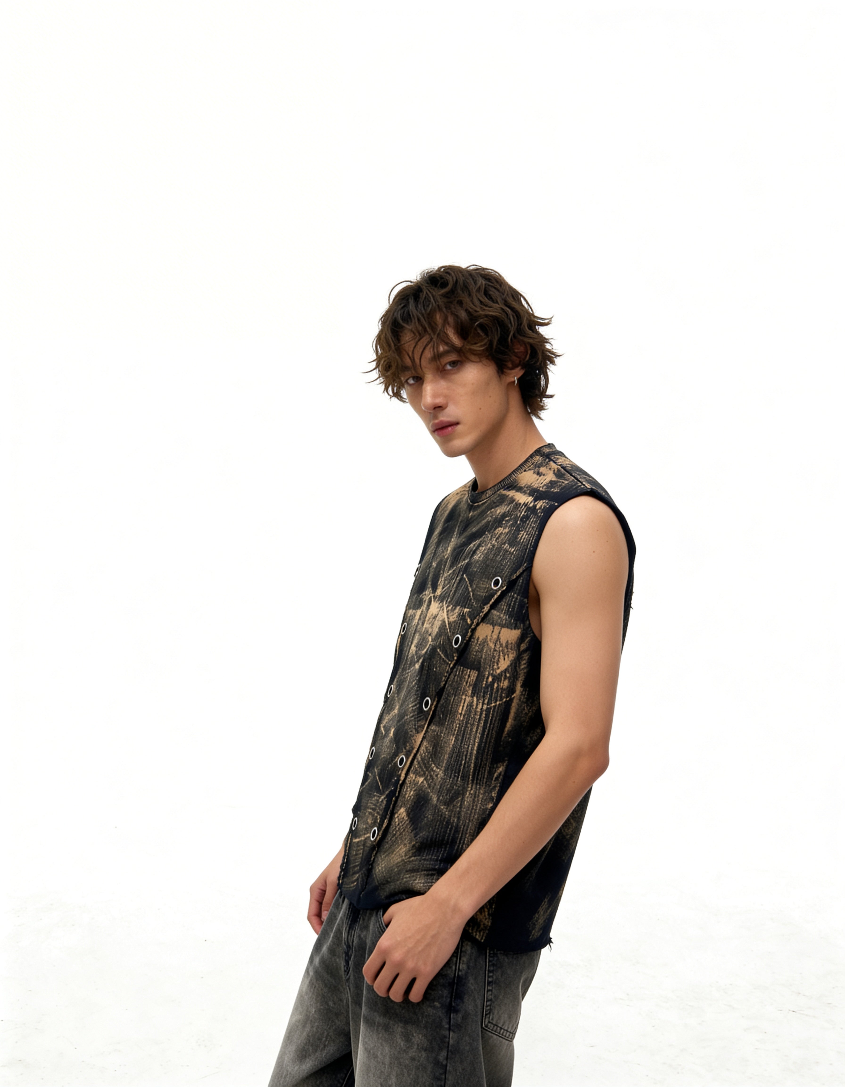 Man wearing a sleeveless camouflage shirt on a white background
