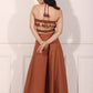 Back view of rust brown crop top and palazzo set with tassel detailing for a stylish summer look