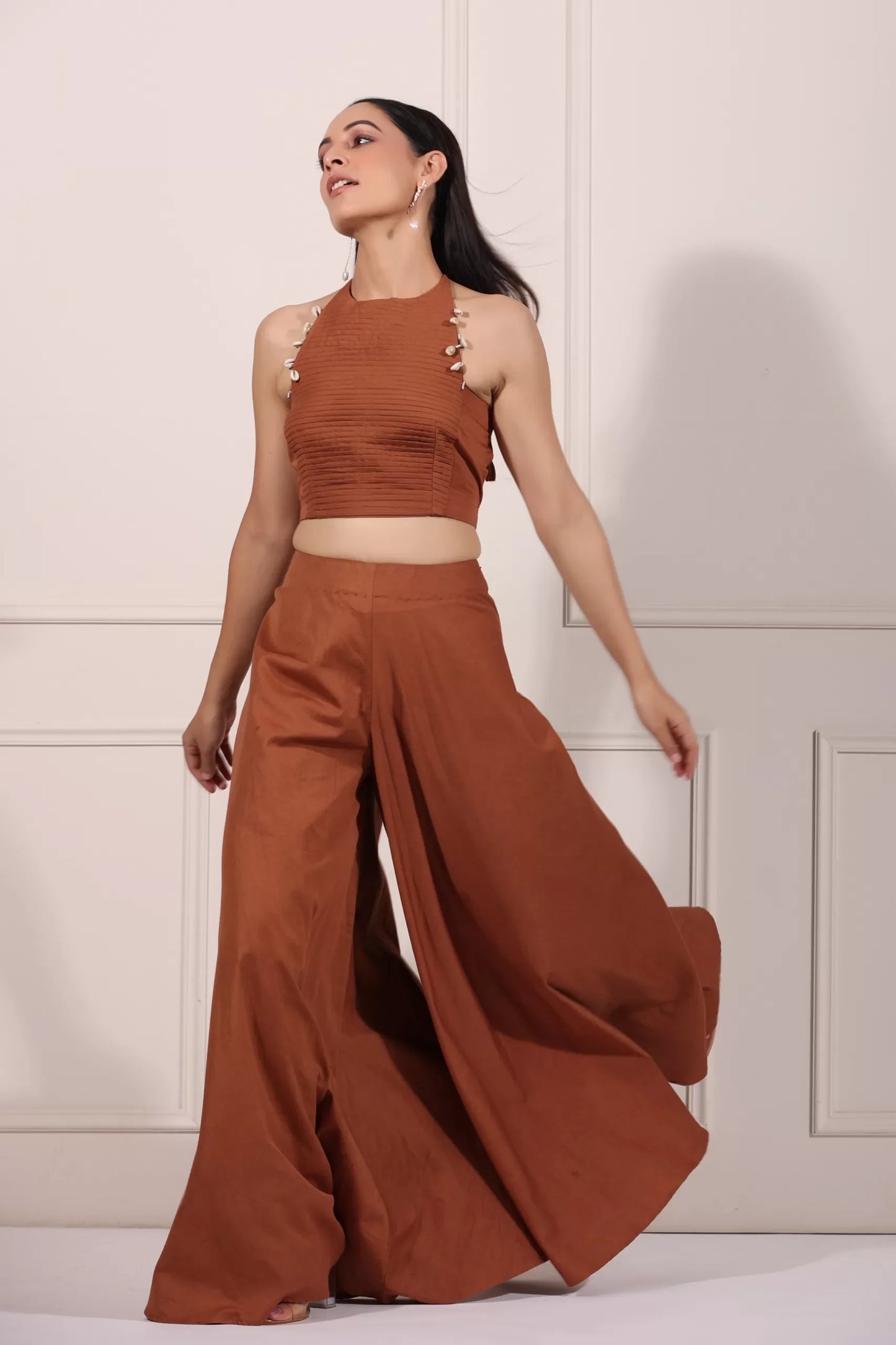 Fashion model wearing rust brown crop top and palazzo set, showcasing a stylish summer outfit