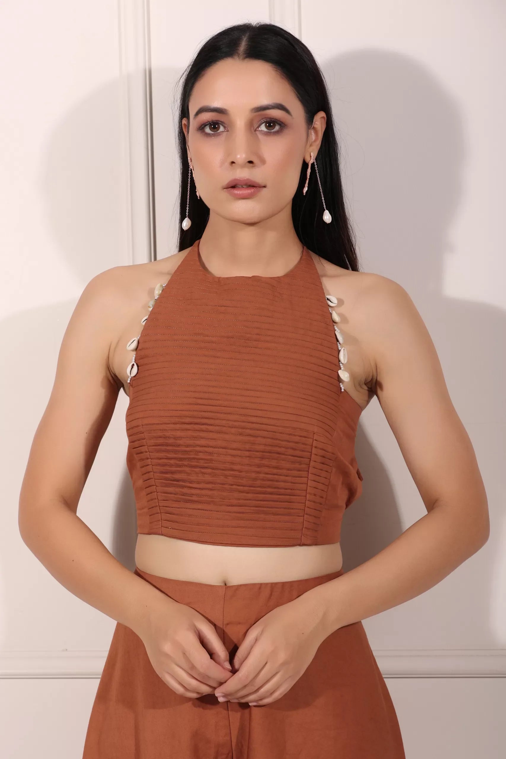 Stylish rust brown crop top and palazzo set with unique shell detailing for a chic look