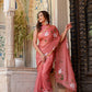 Elegant rust saree with floral hand painting, perfect for festive occasions and celebrations