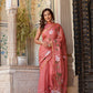 Elegant rust saree with floral hand painting, perfect for festive occasions and adding vibrant style to any wardrobe.