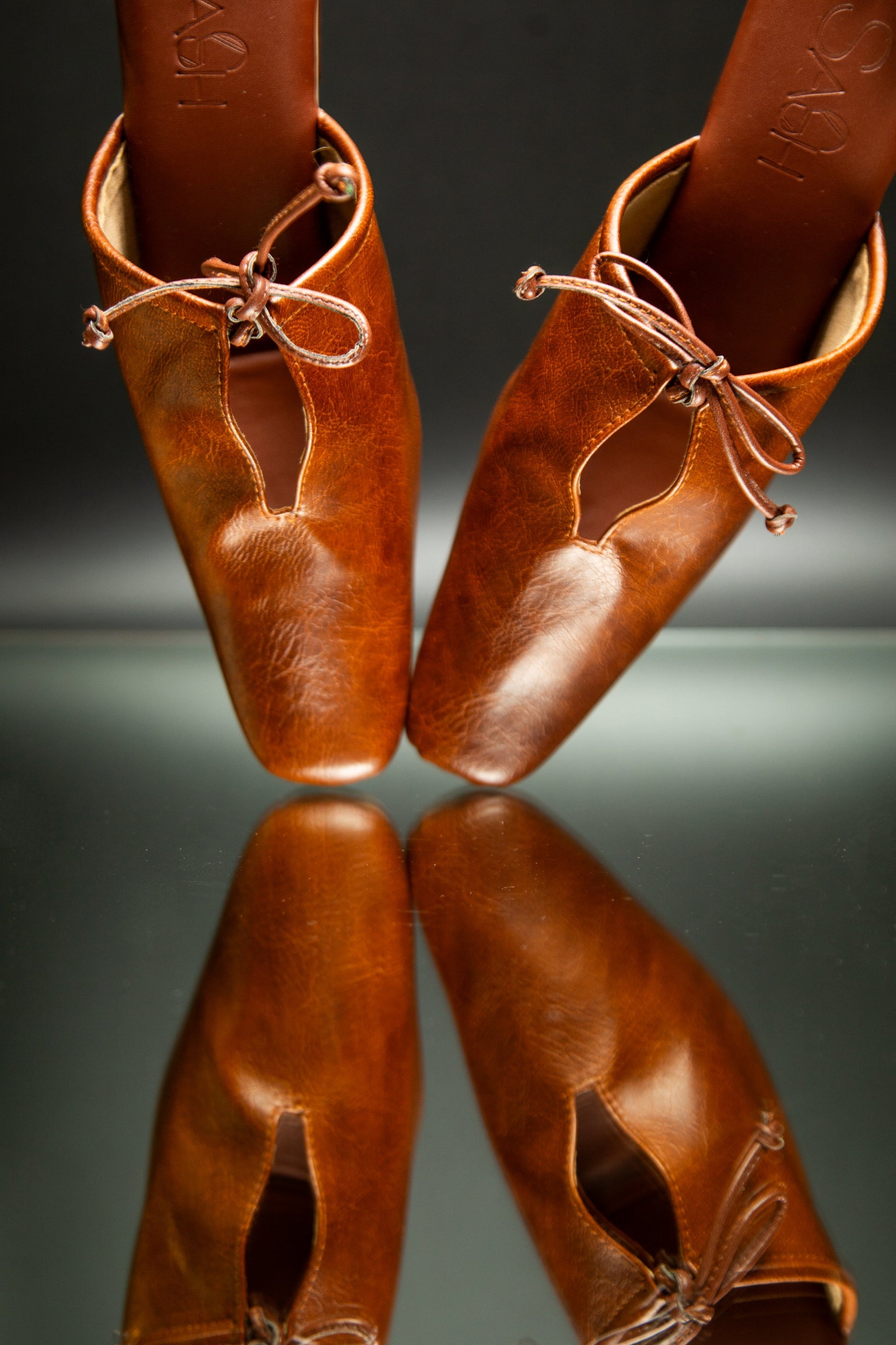 stylera brown slip-on block heel shoes with leather upper and decorative bow detail