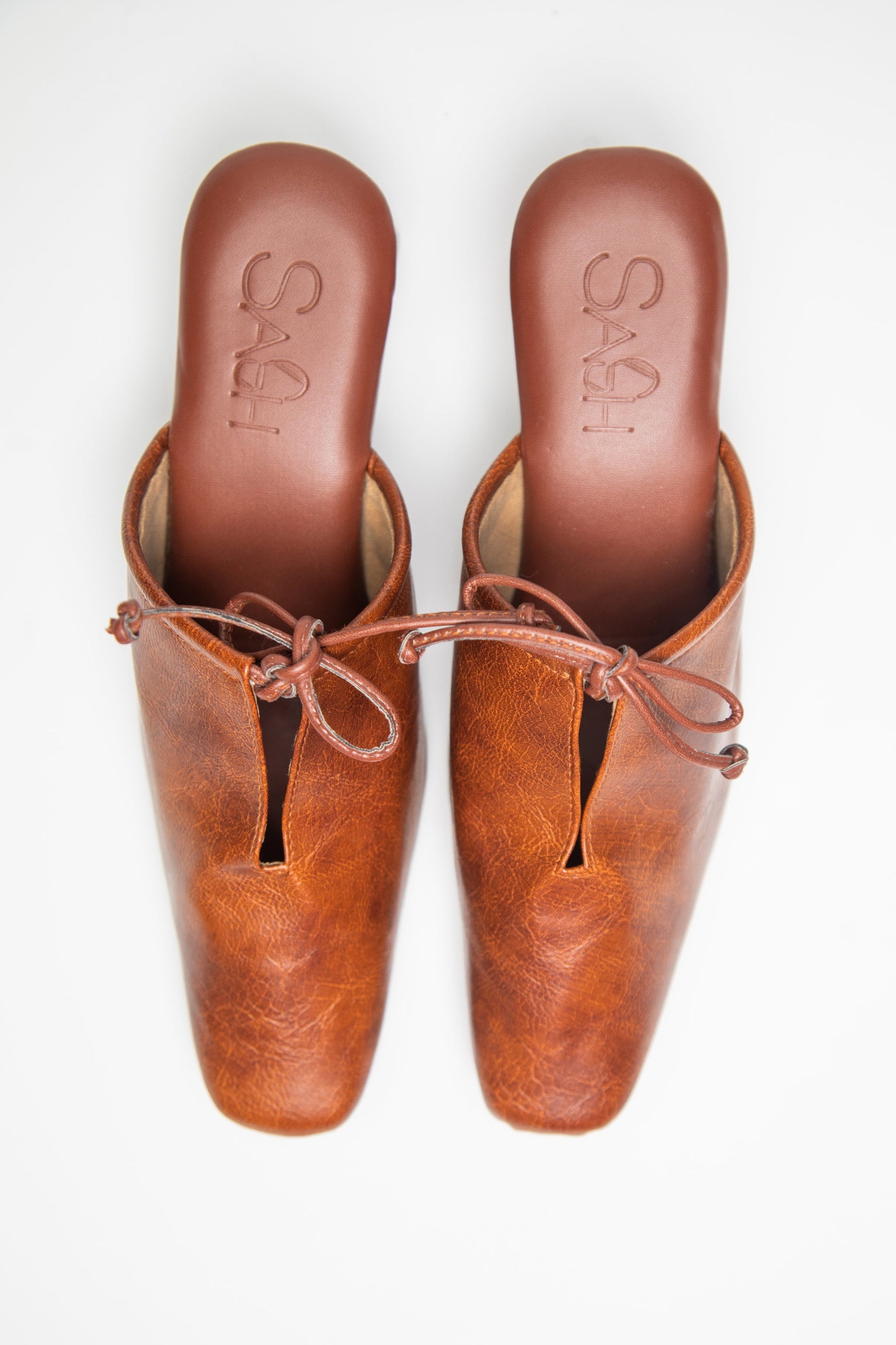 stylera brown slip-on block heel shoes with square toe and bow detail