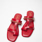 Stylera stylish red flat sandals with gold chain detail on smooth leather straps