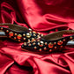 Stylera black heels with gold studs on red satin background trendy gold accent footwear