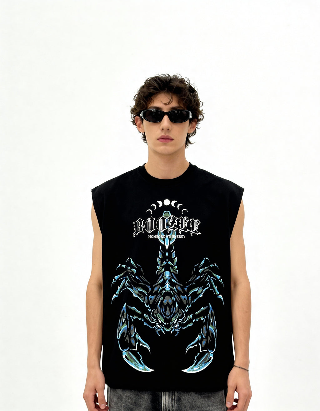 Person wearing a black sleeveless shirt with a graphic design on a white background