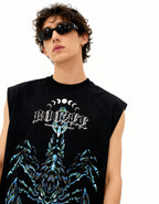 Person wearing a black sleeveless shirt with a graphic design and text.