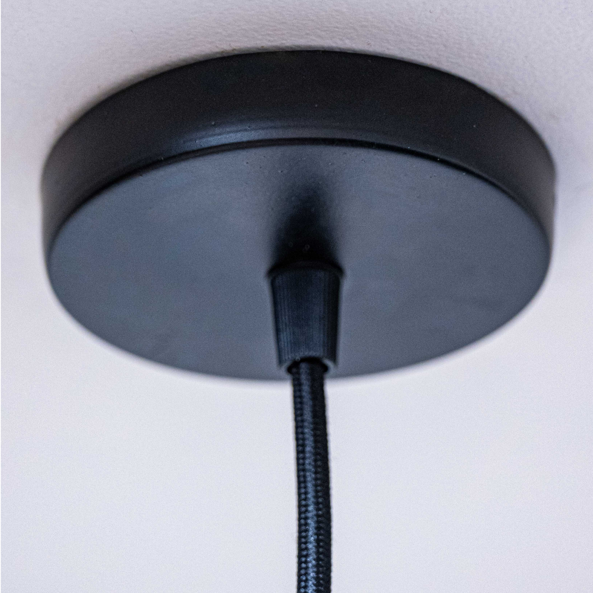 Sozori sculpted white hanging lamp with a sleek black ceiling mount for modern decor
