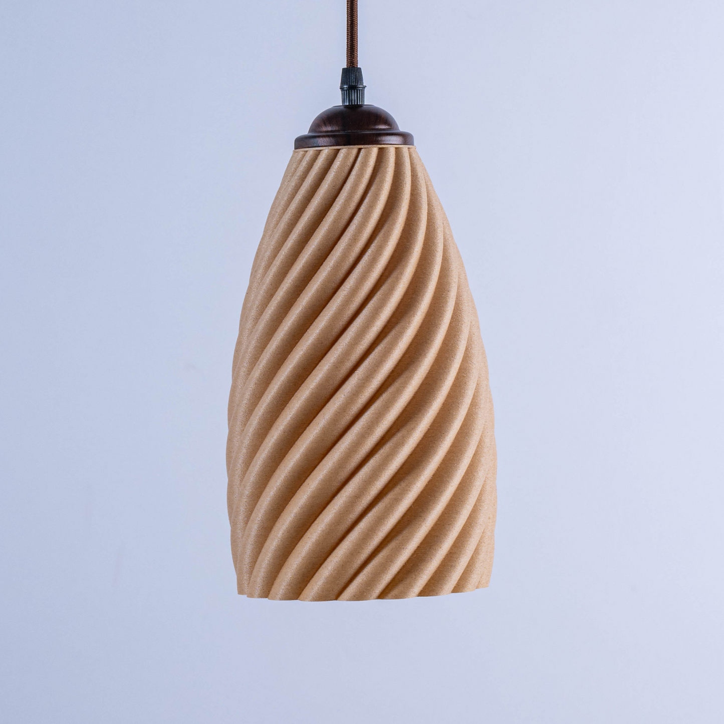 Sculpted white hanging lamp with a unique twisted design, perfect for modern home decor