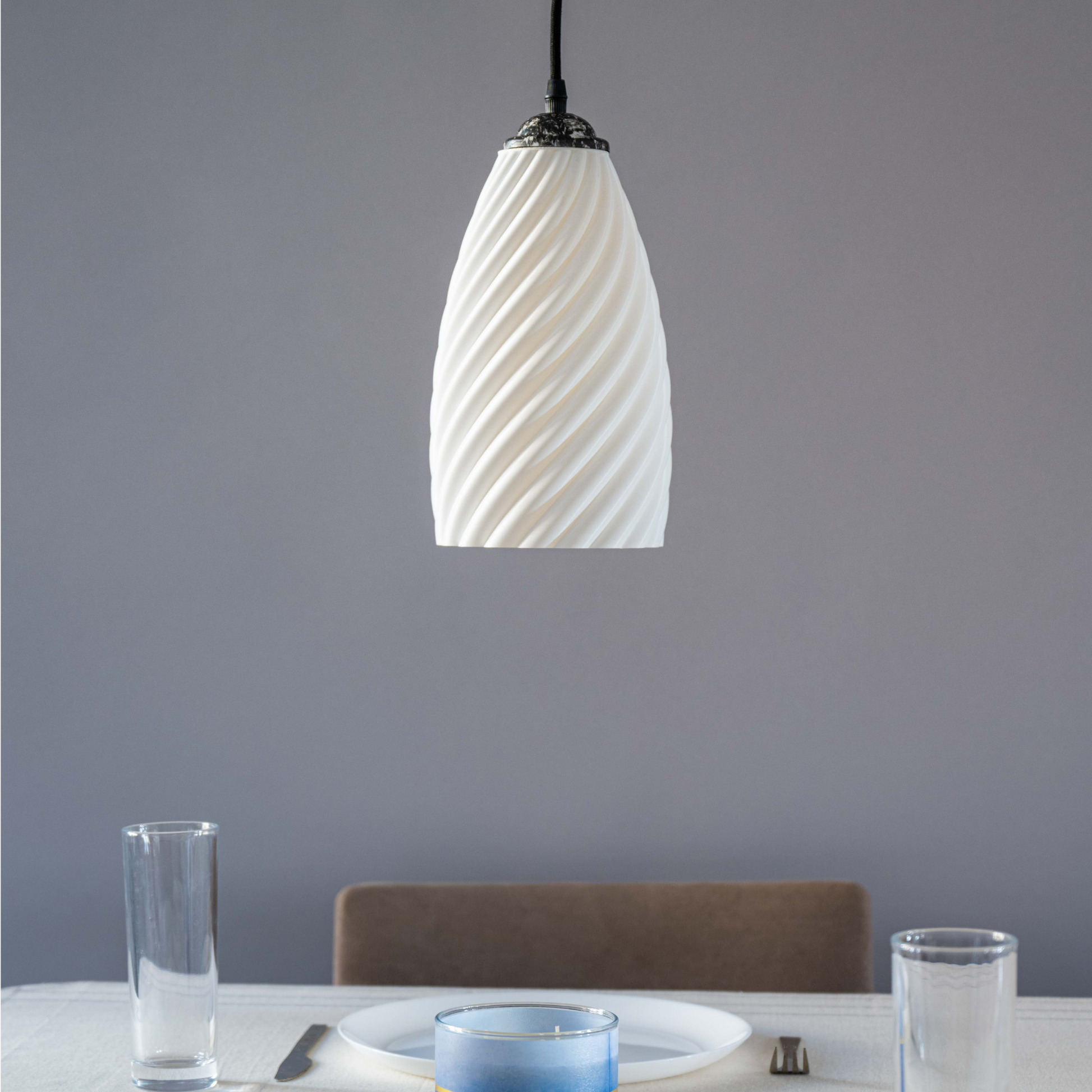 Sculpted white hanging lamp with a textured design, perfect for modern dining spaces