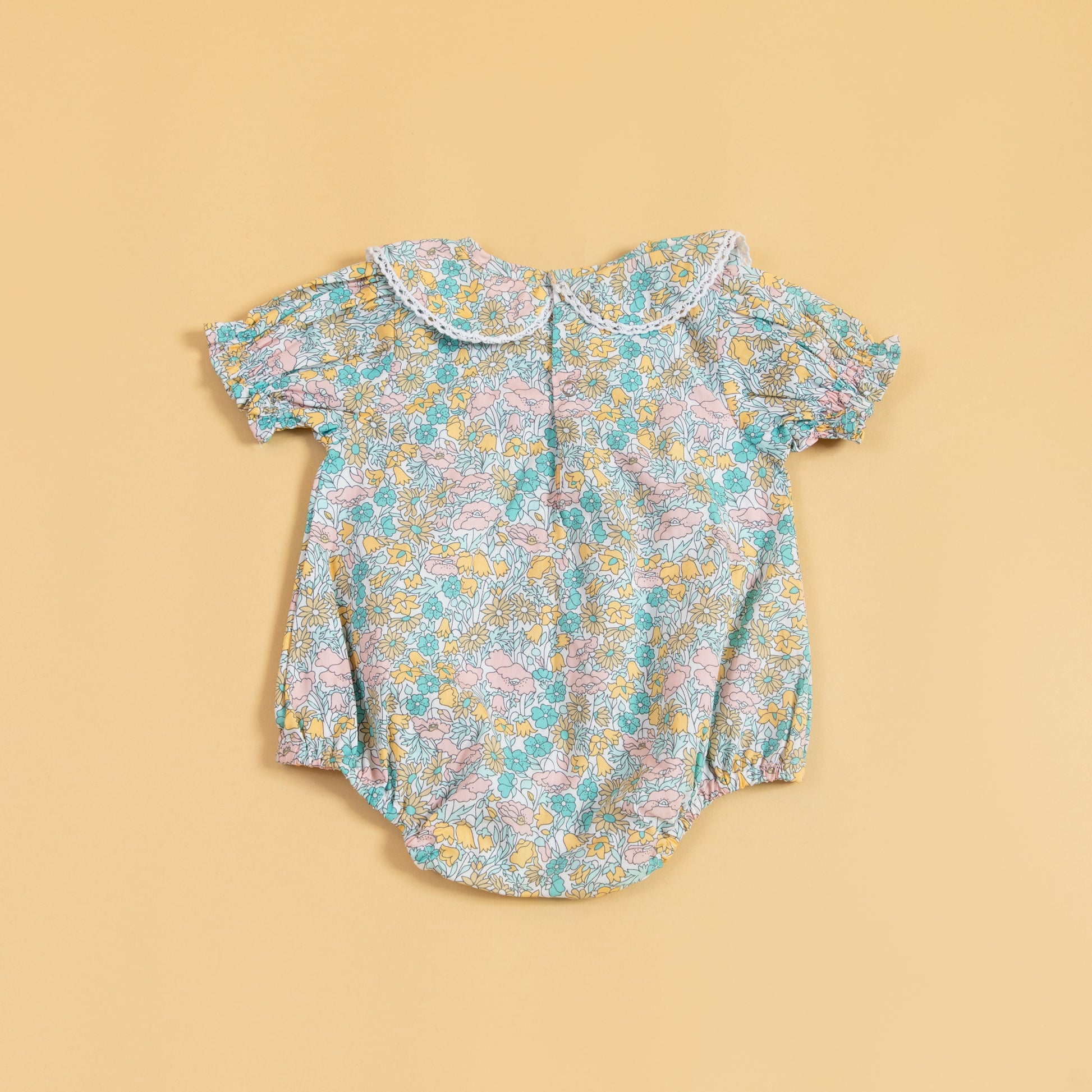 Floral short sleeve baby romper with a lace collar design for stylish infants