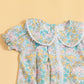 Colorful floral short sleeve baby romper with a cute collar design from Stylera