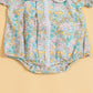 Floral print short sleeve baby romper by Stylera in pastel colors for warm weather