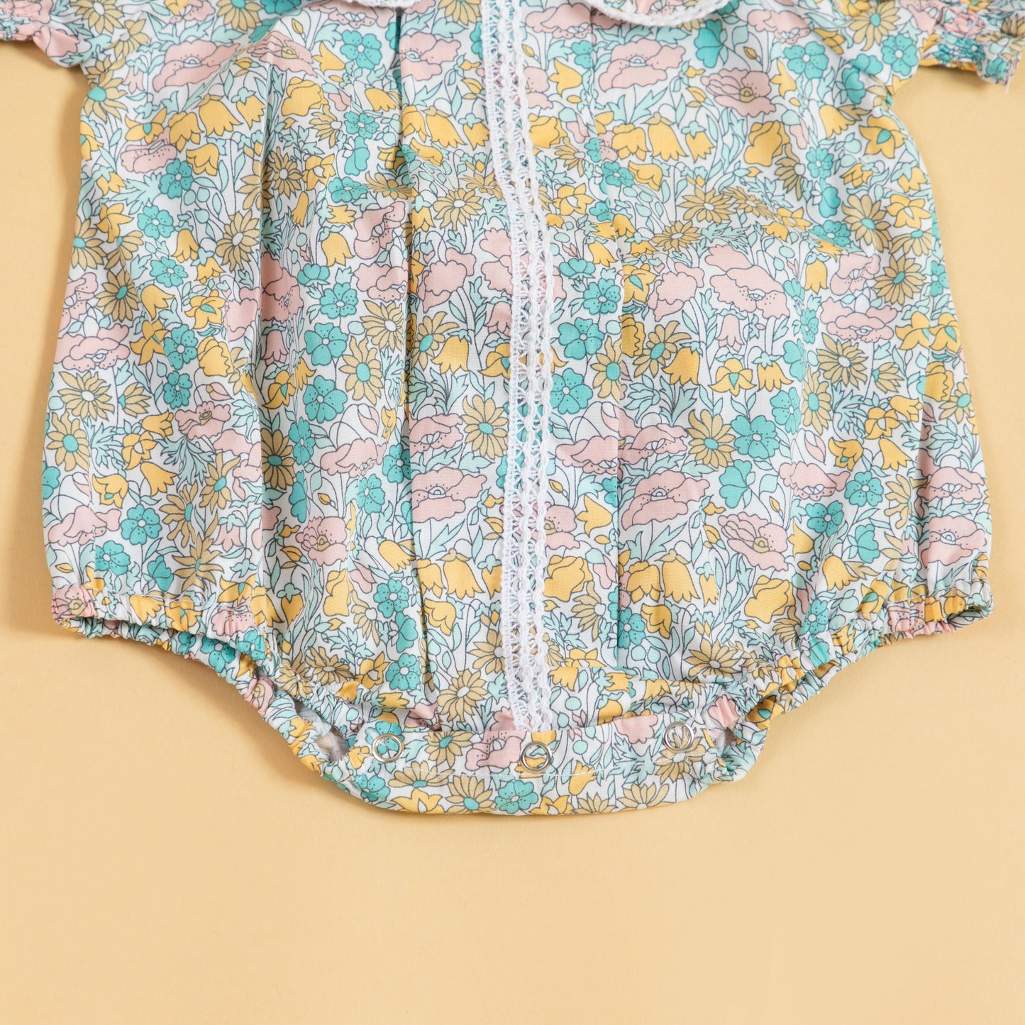 Floral print short sleeve baby romper by Stylera in pastel colors for warm weather