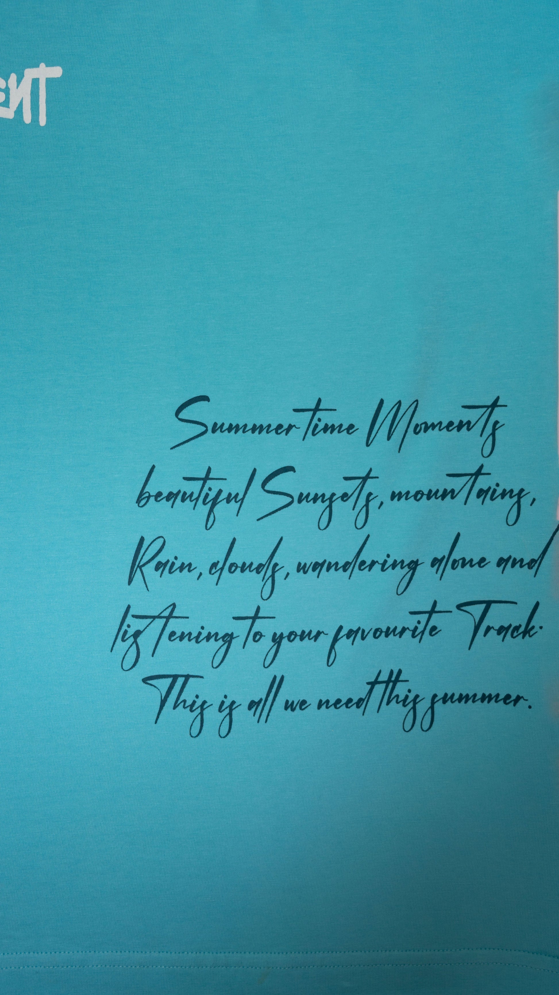 Stylstpls sky blue oversized t-shirt featuring a stylish summer quote in black text