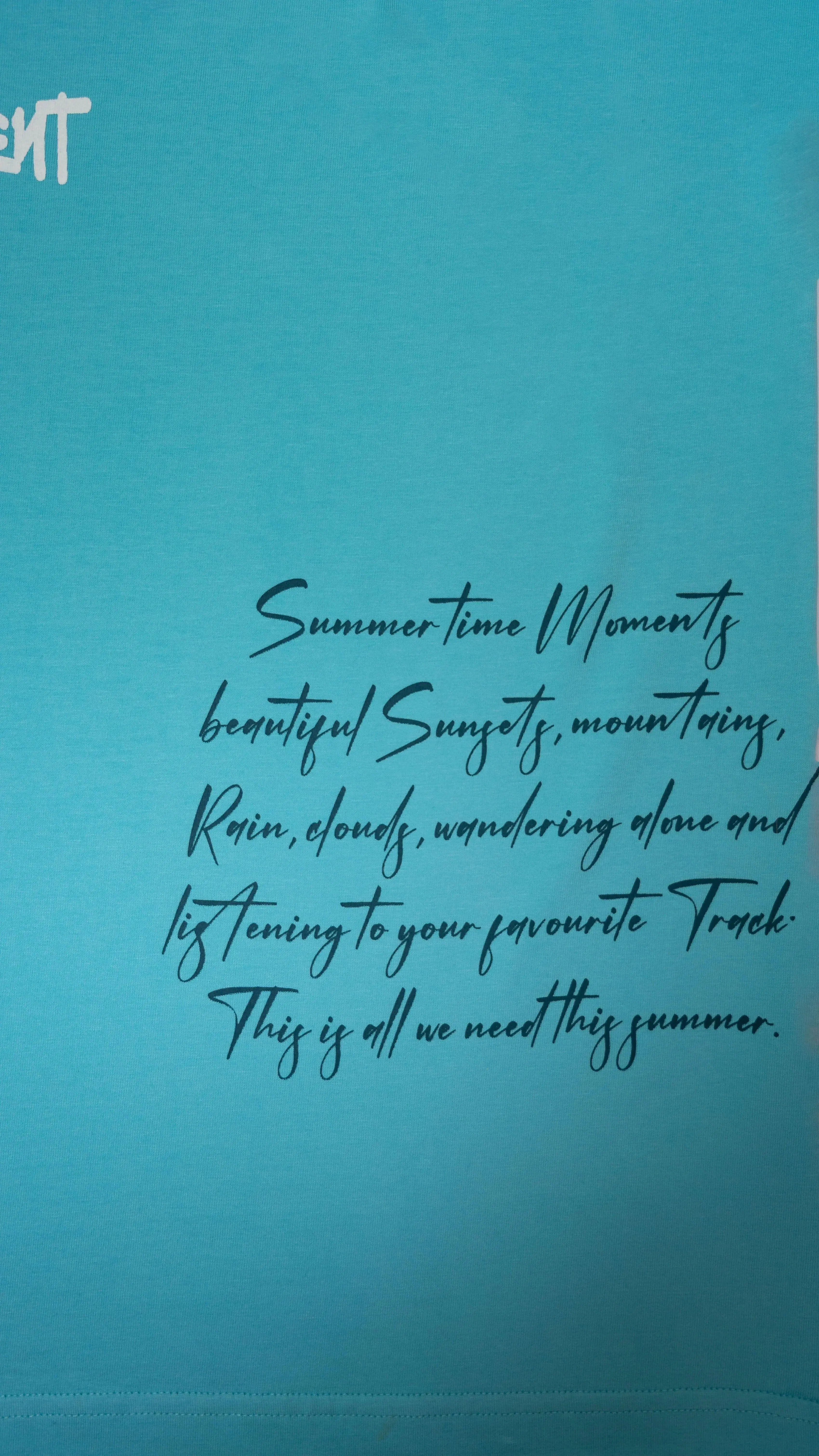 Stylstpls sky blue oversized t-shirt featuring a stylish summer quote in black text