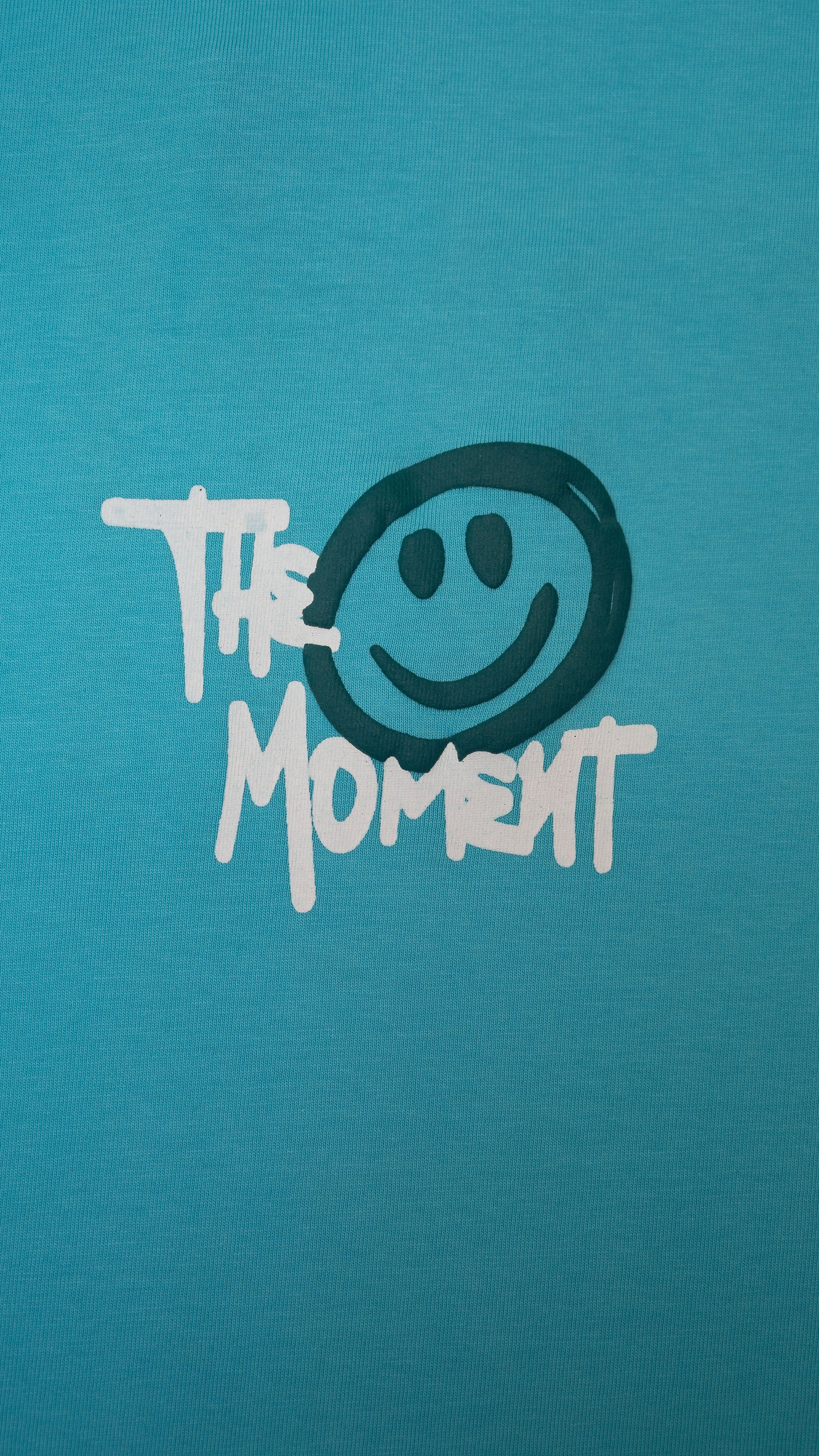 Stylstpls sky blue oversized t-shirt featuring a playful smiley design and bold text