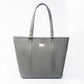 Stylish slate grey tote bag with gold accents and spacious interior for everyday use
