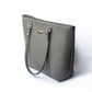 Stylish slate grey tote bag with gold accents and sturdy straps for everyday use