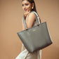 Stylish slate grey tote bag showcased by model with elegant outfit in minimalist setting