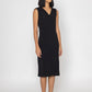 Stylera sleek black evening dress sleeveless V-neck midi length worn with black heels