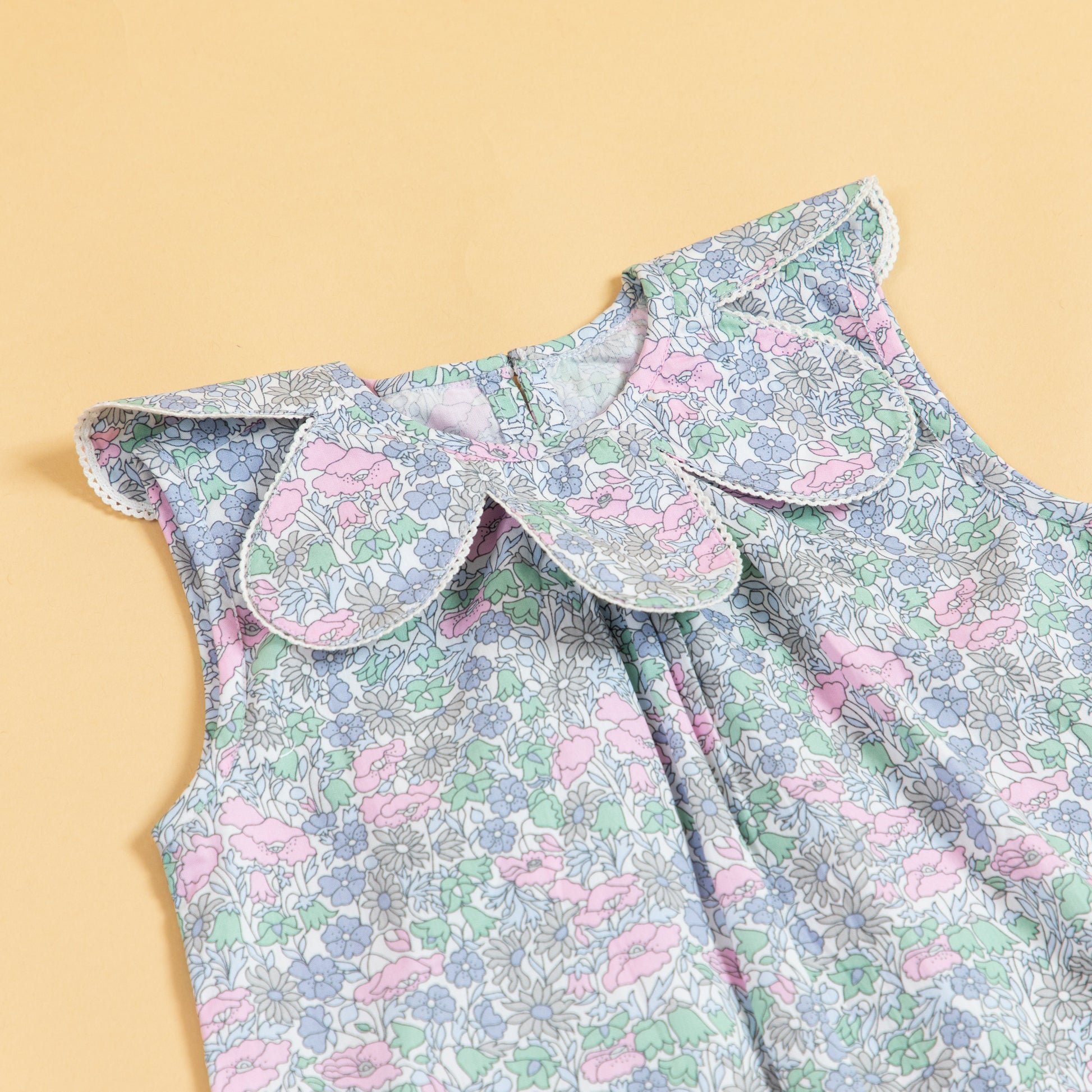 Stylera sleeveless floral print dress with a charming collar design and vibrant colors