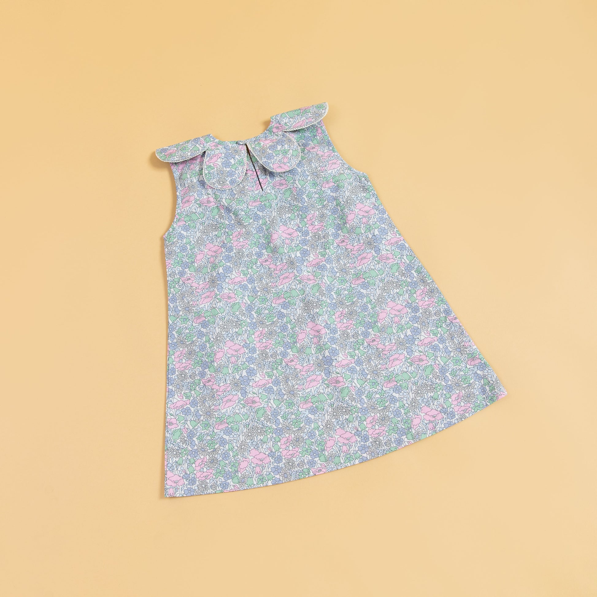Stylera sleeveless floral print dress in pastel colors with a cute collar detail