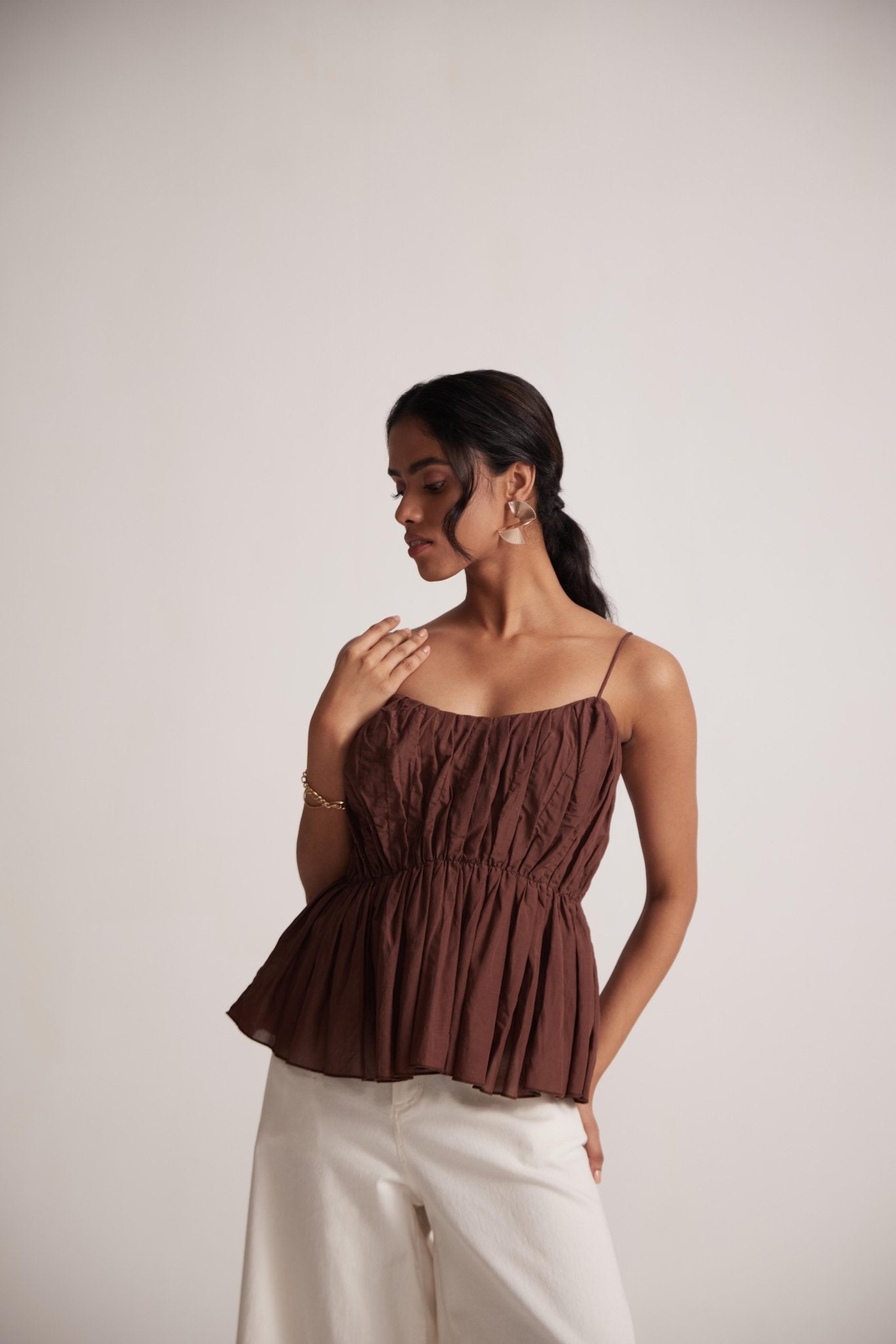 Stylera sleeveless peplum blouse for women in brown with ruched bodice and thin straps