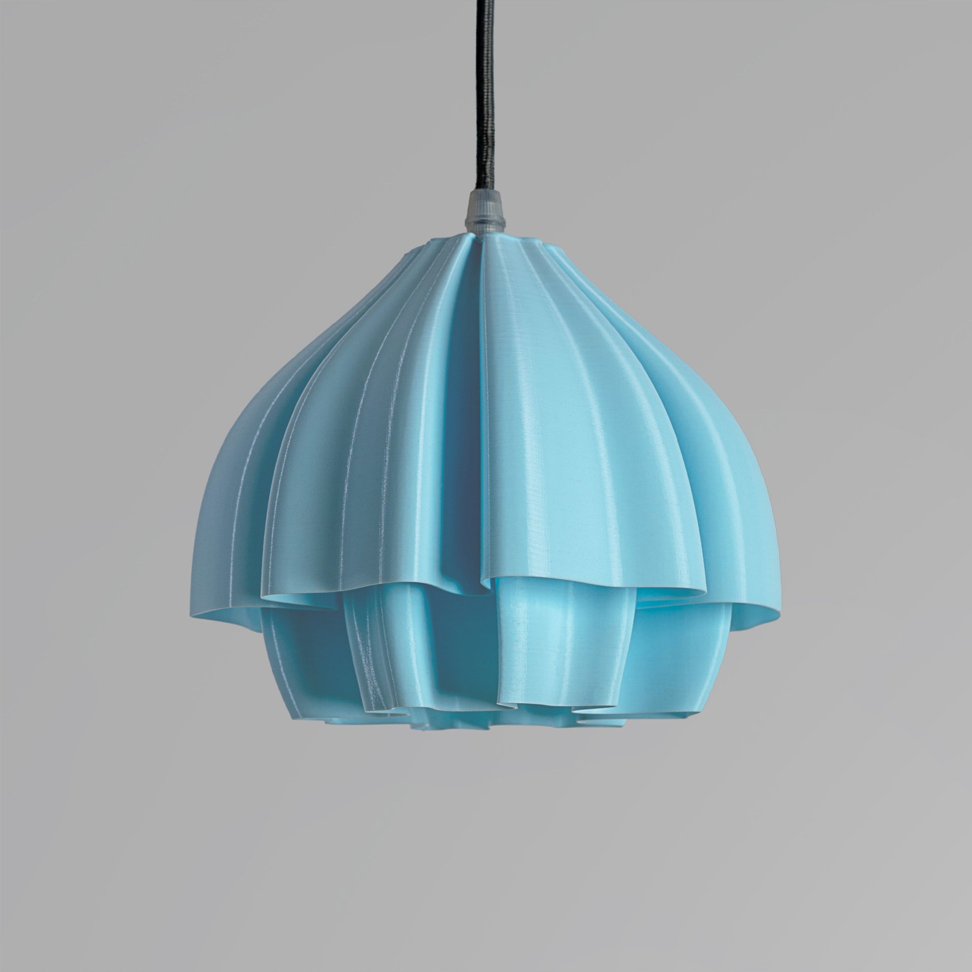 Sozori soft colored decorative lamp in blue with a unique layered design for stylish home decor