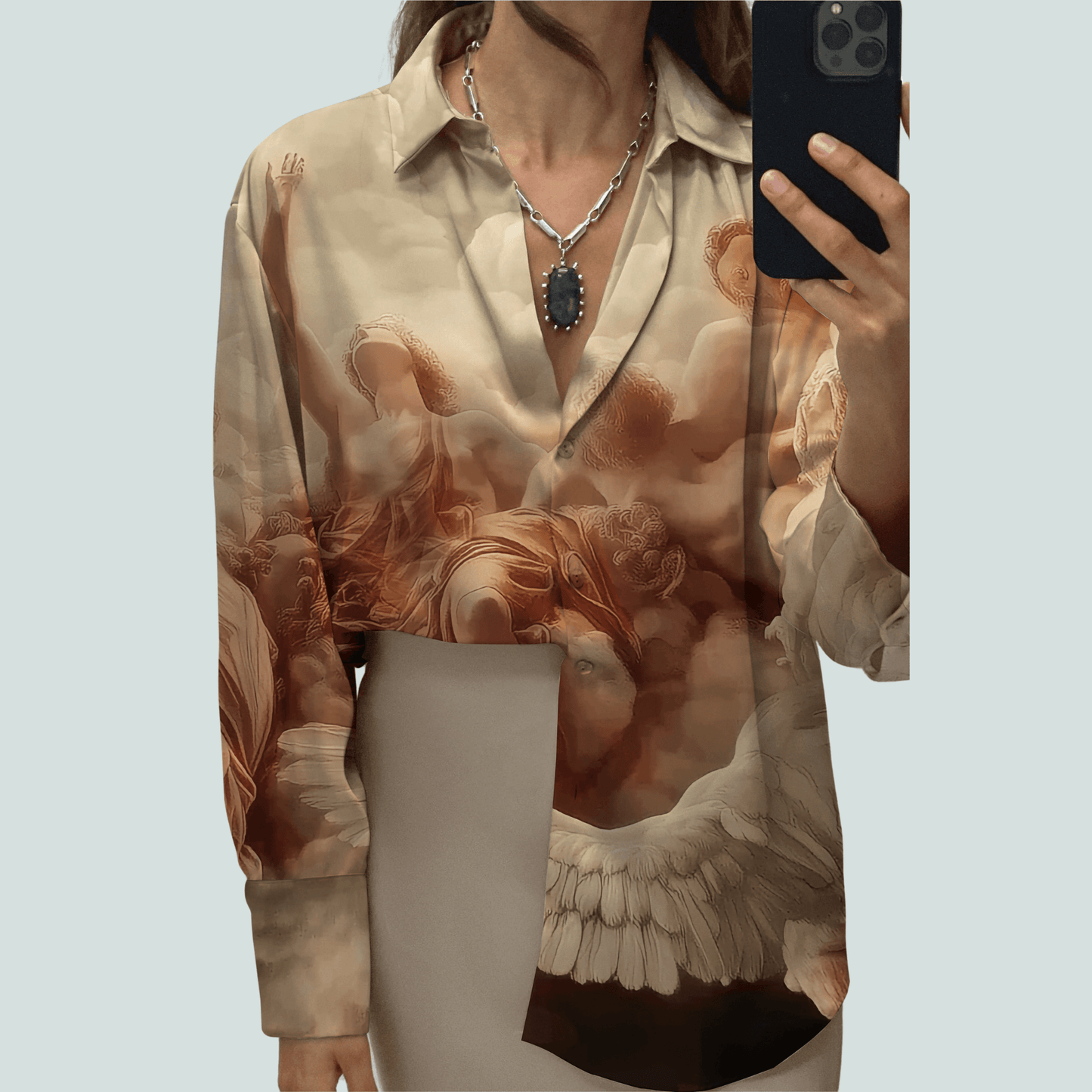 Stylera beige angel print silk button shirt with asymmetric hem and open collar statement fashion tops for women