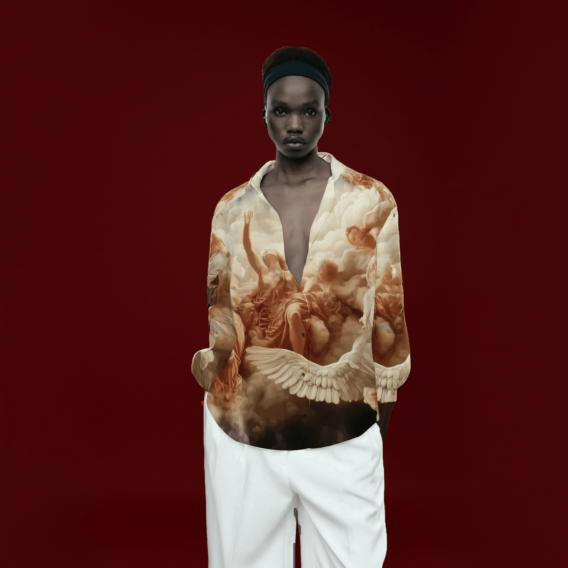 Stylera model wearing printed silk blouse with angel painting and deep V with white pants statement fashion tops for women