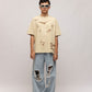 Stylera beige stencil art t-shirt oversized relaxed fit with abstract cutout design on model
