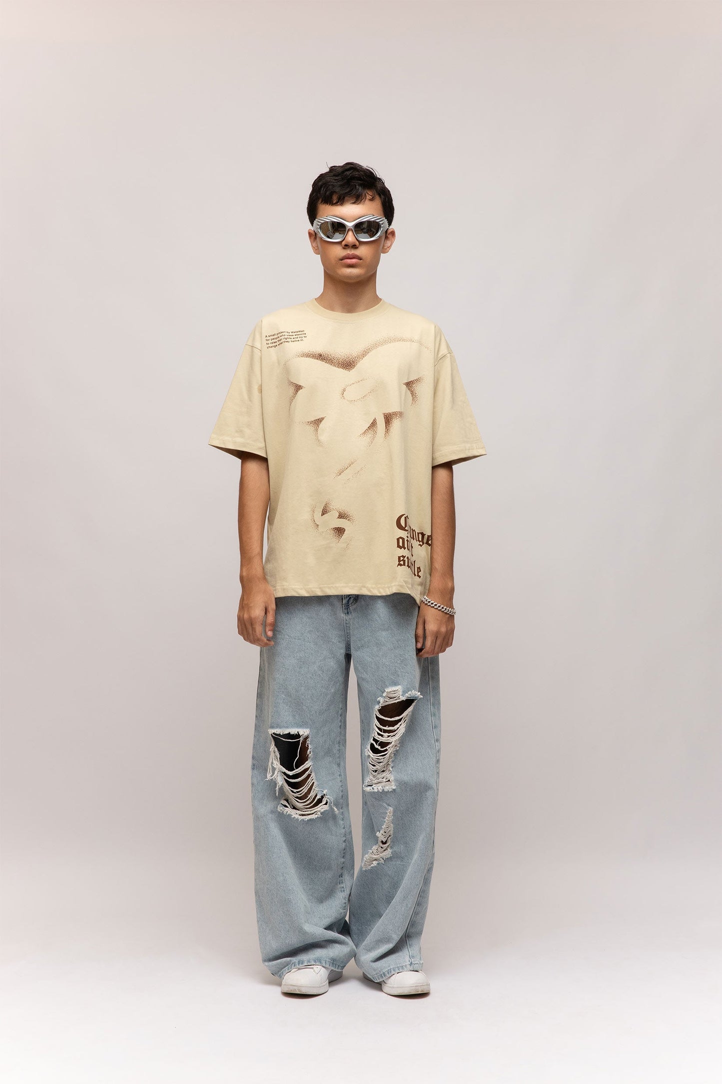 Stylera beige stencil art t-shirt oversized relaxed fit with abstract cutout design on model