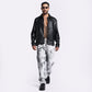 Stylera street style men's fashion jeans in a relaxed fit with a stylish black leather jacket