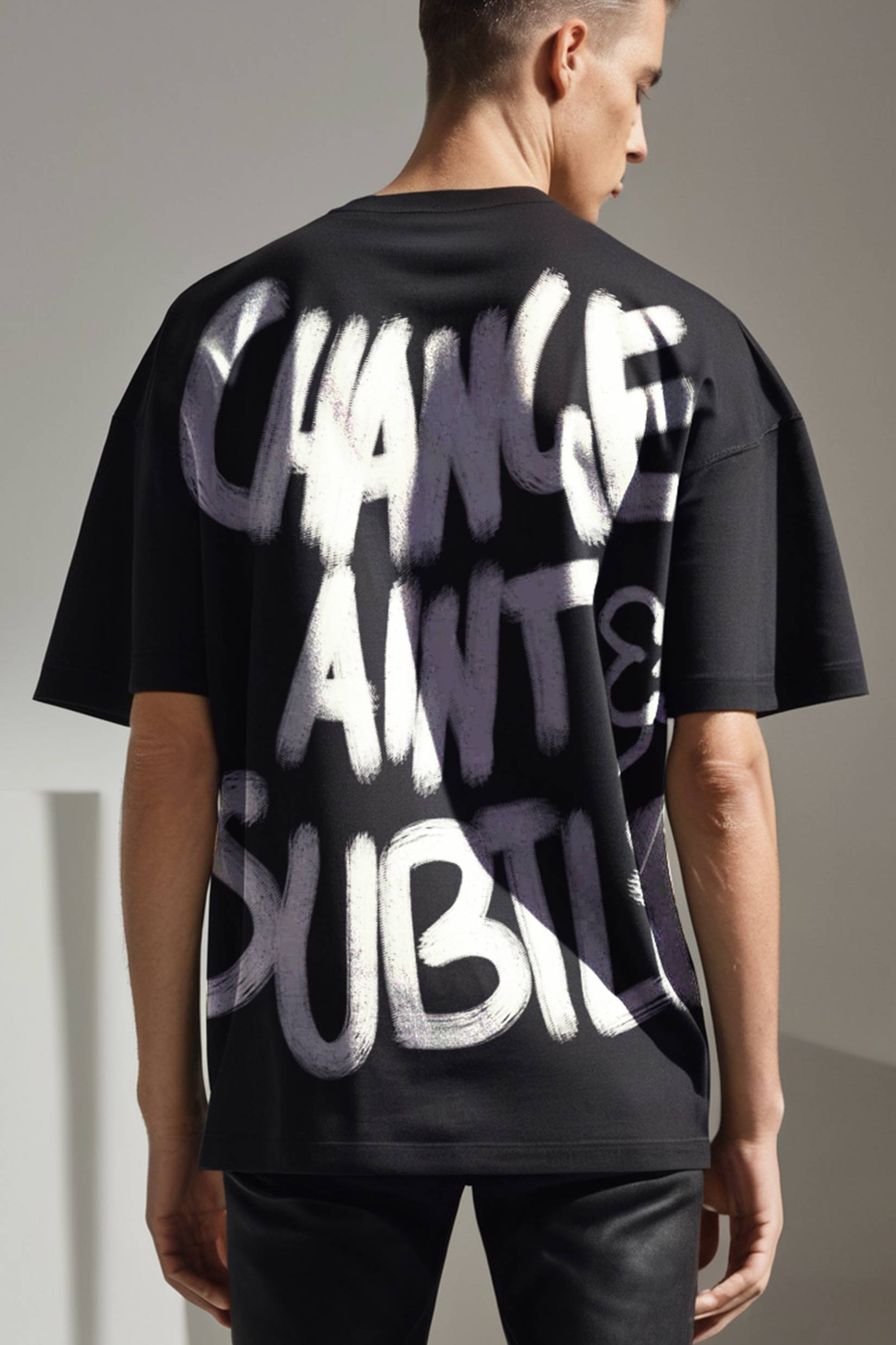 Stylera black oversized t shirt with white graffiti back print on model trendy oversized art tee for men