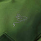 Stylera green cargo pocket joggers close up showing fabric texture pocket edge and brand logo