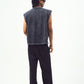 Male model back view wearing Stylera red graphic sleeveless t-shirt shown here in washed black with black pants