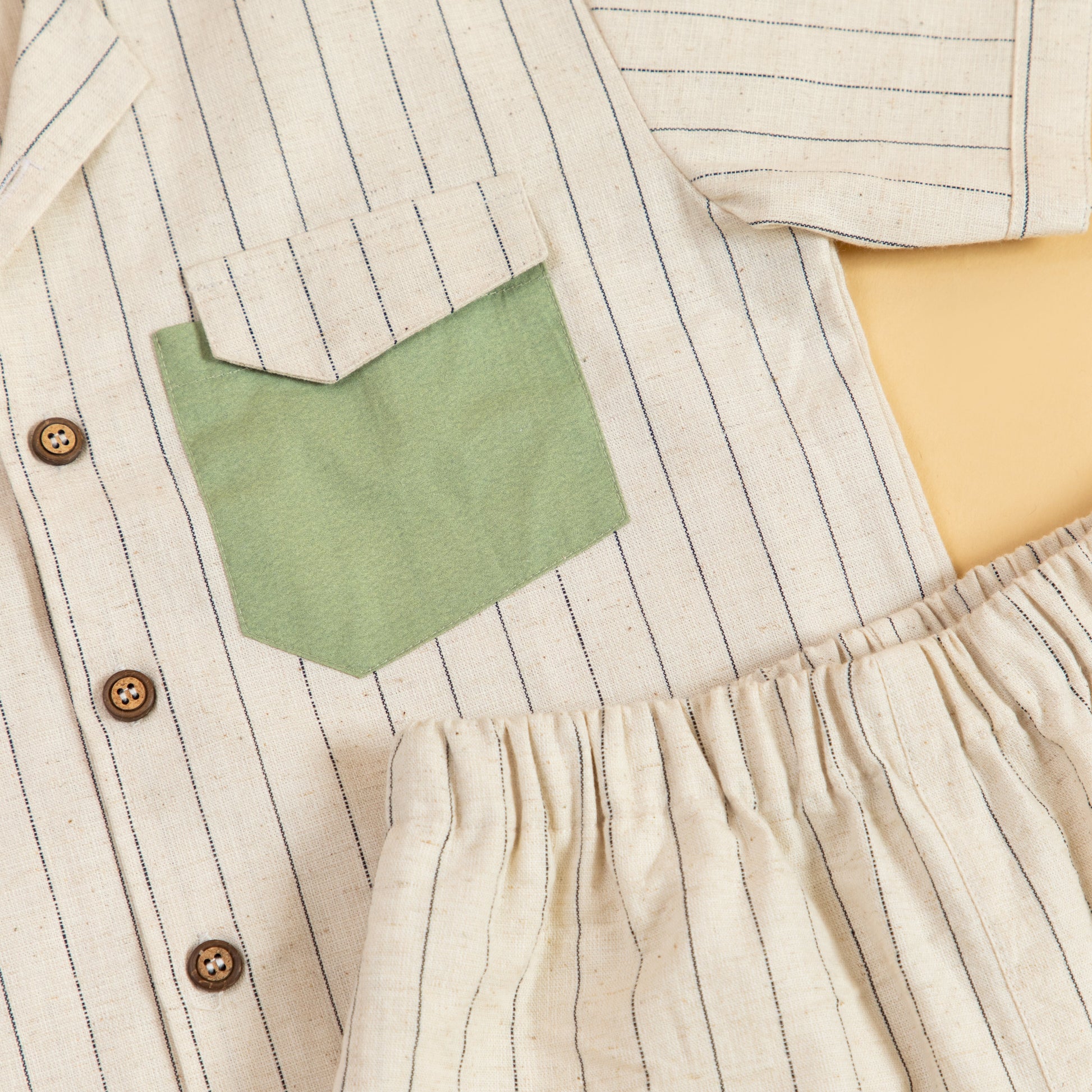 Striped casual two piece outfit featuring a button-up shirt and elastic waist shorts