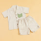 Striped casual two piece outfit featuring a short-sleeve shirt and matching shorts with a green pocket